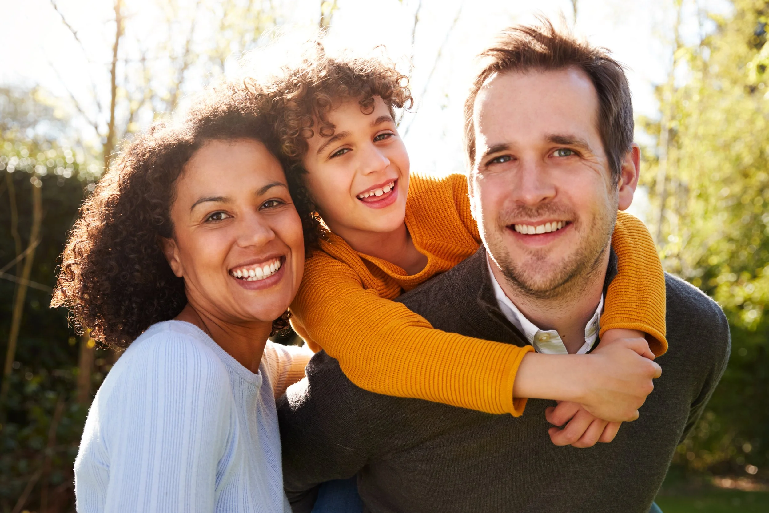 family packing a backpack with emergency supplies